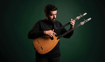 Performer Ozan Baysal playing a bağlama, a double-necked lute common in Turkish music