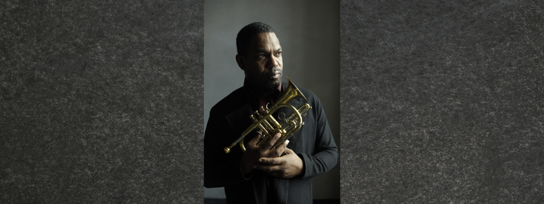 Trumpeter Byron Wallen holding a cornet.