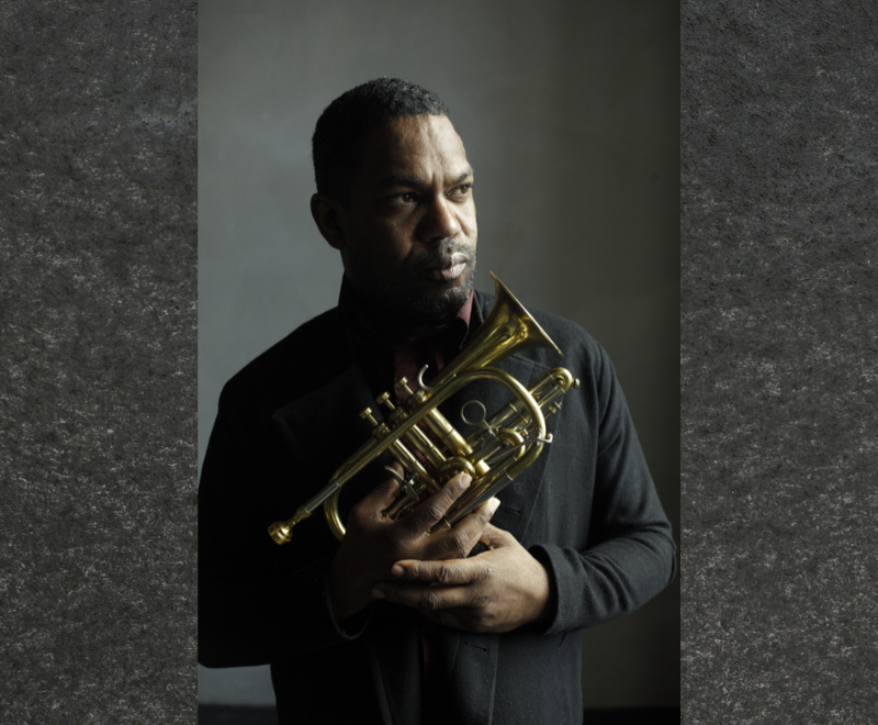 Trumpeter Byron Wallen holding a cornet.