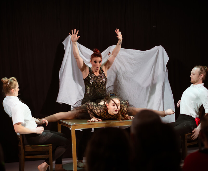 Members of Spooky Circus reveal themselves from under a white sheet