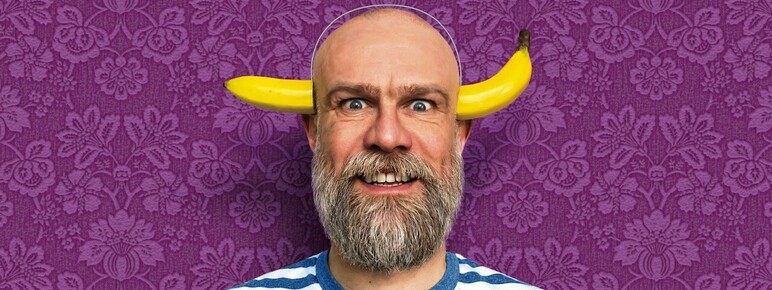 Children's author Olaf Falafel with a banana through his head.