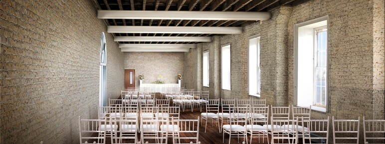 A render of a long room with pale brick walls, exposed timber ceiling, tall windows, and white chairs facing a decorated table at the end. The room is dressed for a wedding.