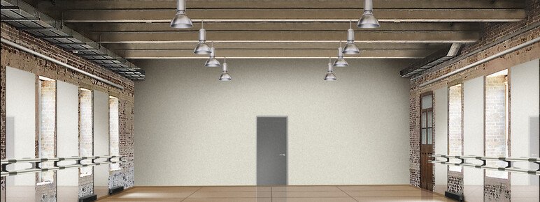 A render of a dance studio, with large panelled flooring, exposed beams across the ceiling, and tall mirrors and ballet barres along the walls. The end wall is plain white with a grey door in the centre.