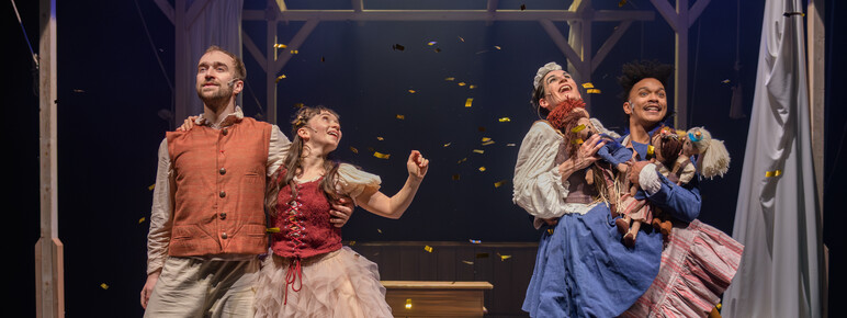 Four dancers from Protein Dance performing on stage in The Magic Flute