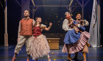 Four dancers from Protein Dance performing on stage in The Magic Flute